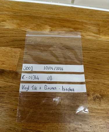 Asbestos sample bag labelled during management survey in Cambridgeshire