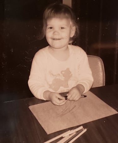 Cindy as a little girl drawing