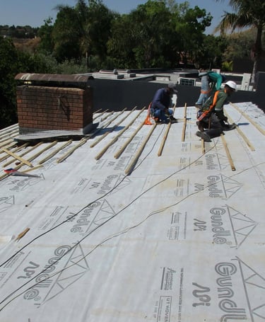 Underlayment set out for roof replacement project in Hyde Park, Sandton, Environmental Pro Construction