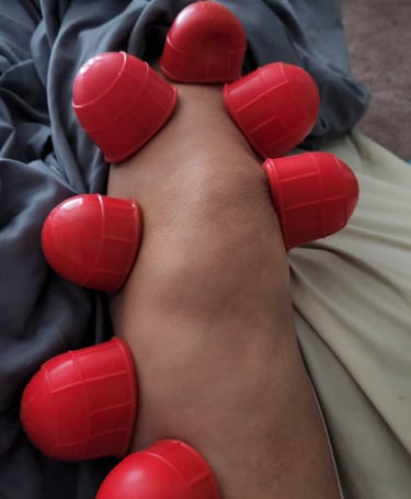 a person with red rubber balls on their feet