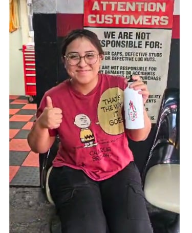 Satisfied customer showing appreciation for Fast Tire Shop’s friendly and professional service in Ea