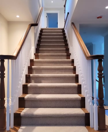 Custom wood staircase design with natural wood railings for modern and classic interiors