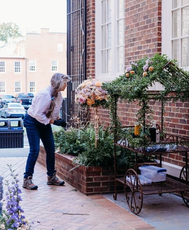 a woman standing in front of a building