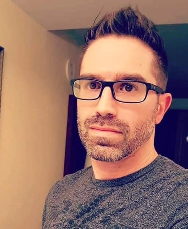 a man with glasses and a beard and a beard