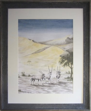3 Gemsbok/oryx in the Kalahari Desert as the first rays of day's sun tint the edges of the sanddunes
