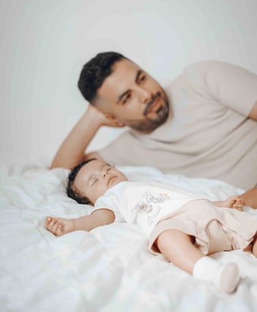 Father and baby relaxing on bed – Fred Art Studio home session