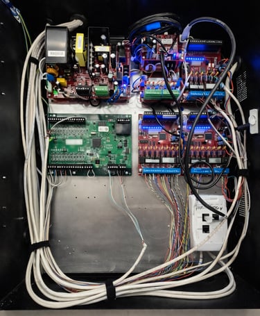 Commercial access control and power distribution panel with neatly routed wiring.