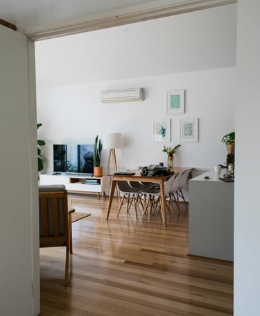 A wall ac unit cooling off a room . 