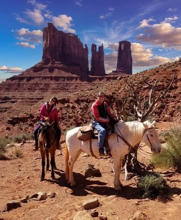 Riding horseback along the base of Stagecoach Butte in the heart of Diné Land (Monument Valley AZ)