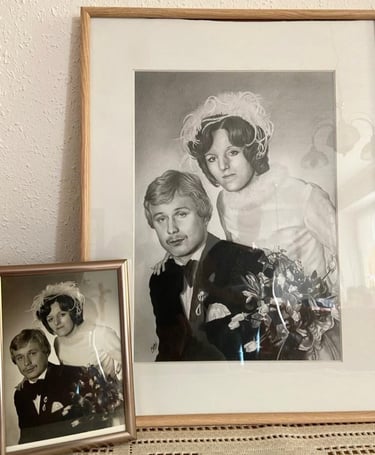 an small old wedding picture sitting next to a pencil drawing of the same picture
