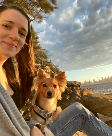 A selfie of Allison Lozes and her rescue dog enjoying Sydney Harbour