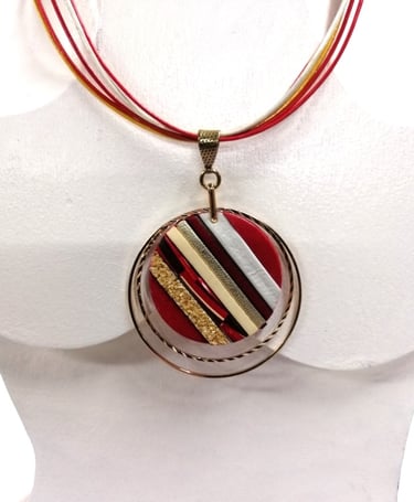 a necklace with a red and white striped necklace
