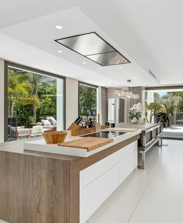 Modern white kitchen with island at Villa Serenity