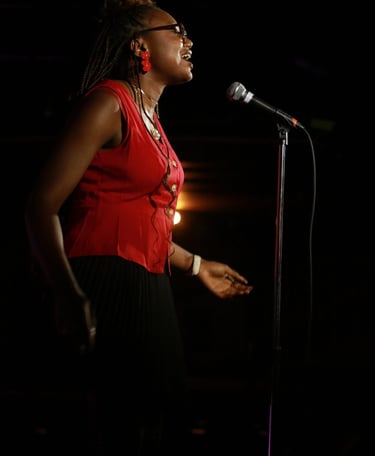Iheoma Uzomba Oma is Loud performs poetry at the Calgary Poetry Slam