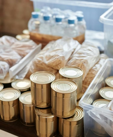 Canned grocery items and water bottles