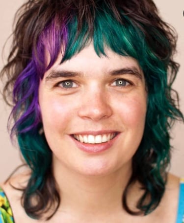 person with black, purple and green hair