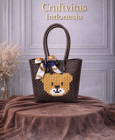 Brown handwoven plastic tote bag with bear character design, handmade sustainable tote bag