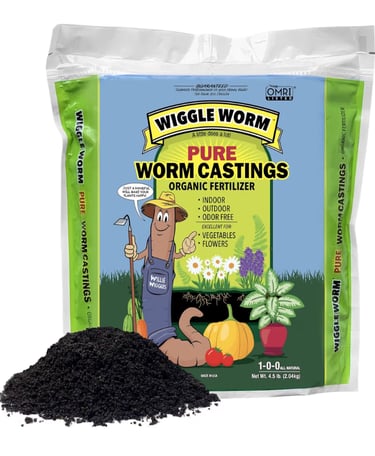 Organic worm castings added to soil to improve plant nutrition and promote strong root development