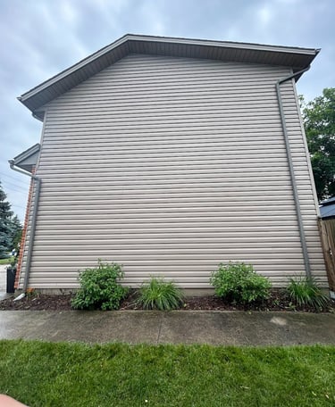 a photo of siding that a pressure washed and got all the dirty algae off