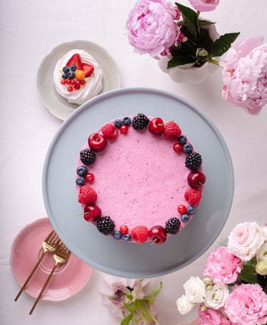 a cake with berries and berries on a plate