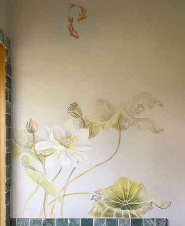 Dramatic mural with softly coloured lotus, foliage and koi in serene spa bathroom.