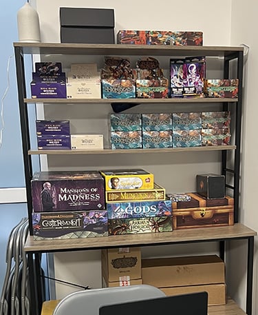 Stock of sealed product for Flesh and Blood, One Piece TCG, Dragon Ball Fusion, and board games.