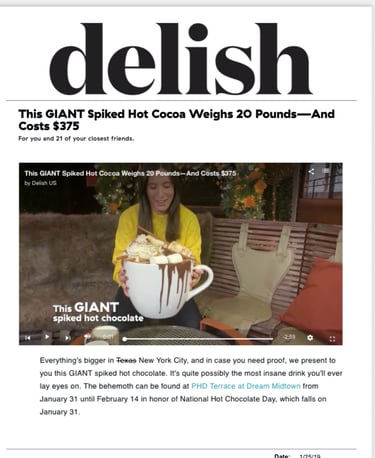 a lady holding a 20 lb boozy hot chocolate