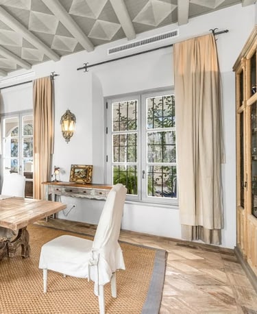 Elegant dining room with rustic beams at Finca Santa Katerina