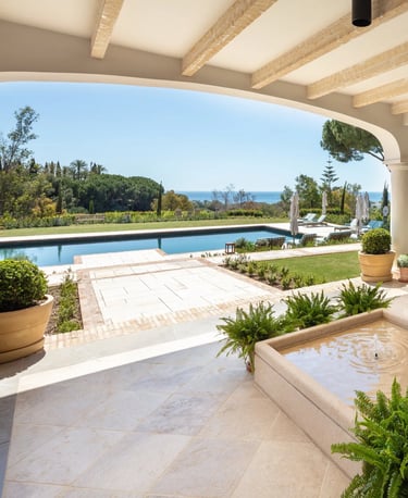 Terrace lounge at Villa La Gratitud with sea views and shaded pergola
