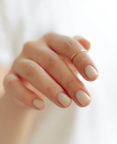 a woman's hand with a ring on her finger