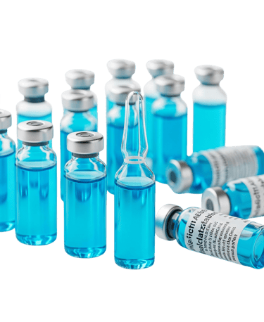 a group of bottles of blue liquid in a row of vials