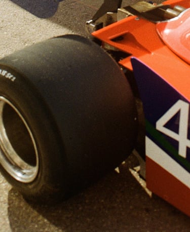 a race car parked in the paddock