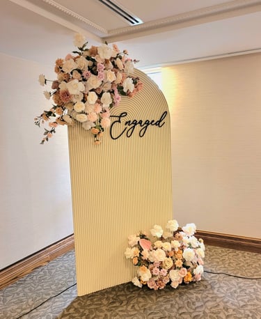 engagement party backdrop with a beige backdrop 