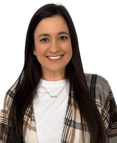 woman with long dark hair wearing a a white shirt and plaid scarf