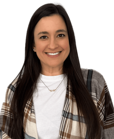 woman with long dark hair wearing a a white shirt and plaid scarf
