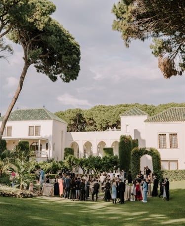 Garden event at Villa El Rincon with guests gathered among lush greenery