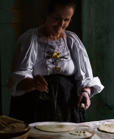 Woman in traditional Oliena dress making pane carasau, Sardinia