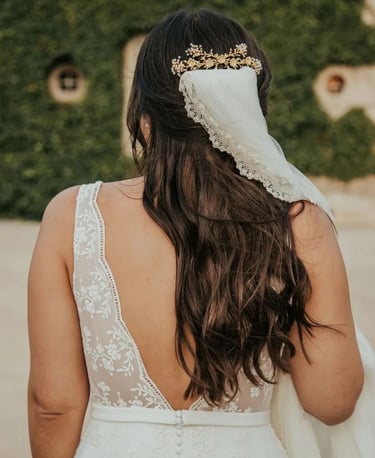 Bride wearing hair accessory and white veil styled by letshair