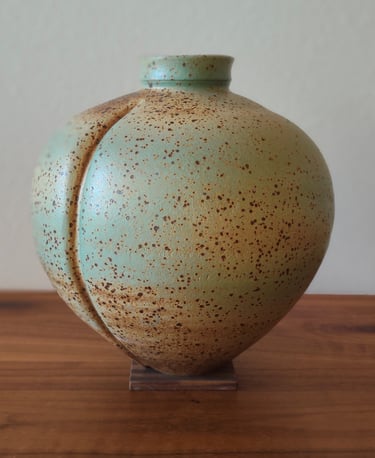 wheel-thrown and altered vase, spray-glazed with a base coat of green and top coat of earthy brown