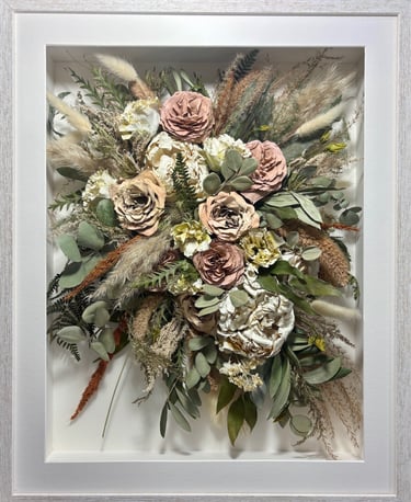 a trailing preserved wedding bouquet in a frame