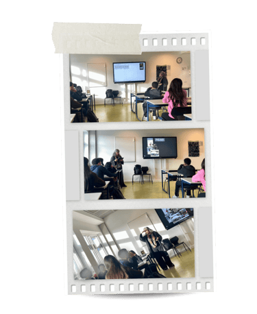 Students in a modern classroom attending a lecture with a teacher and interactive screen.