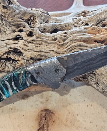 Mammoth Tooth Handles makes these knives a uniqe collectors item as well as a usuful tool.  