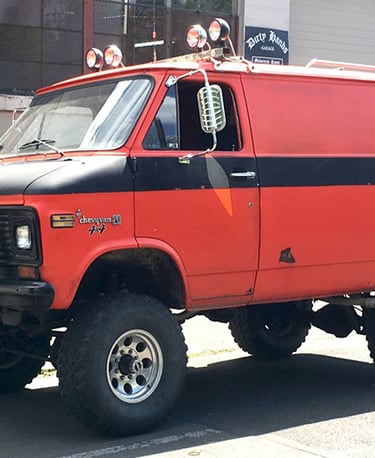 a lifted red van