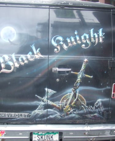 a van with a black and knight on the back