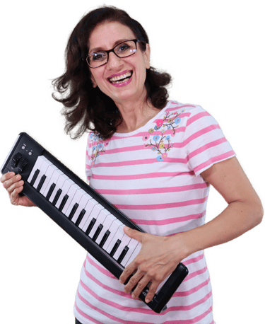 a woman in a striped shirt and glasses holding a keyboard
