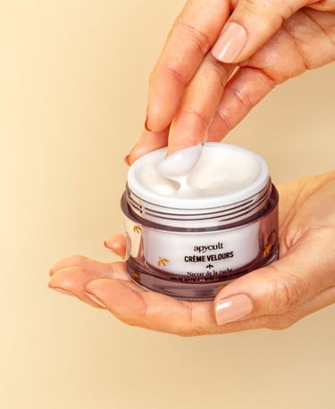 a person holding a jar of face cream in their hands and show the texture