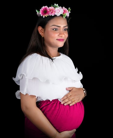 Maternity photoshoot in Dubai – Mom-to-be cradling baby bump at Pixel Craft Studio.