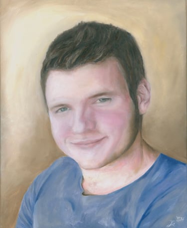 a portrait of a young man with a blue shirt