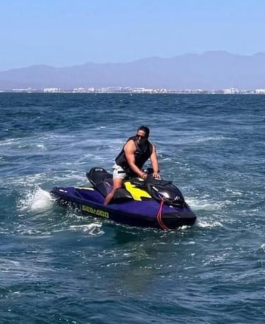 a man riding a jet ski in the ocean