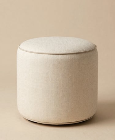 Cozy living room corner with a plush sofa and warm lighting.